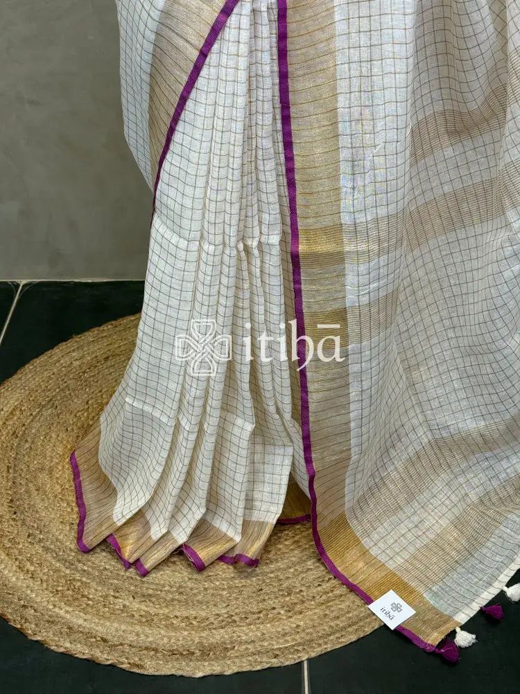 LINEN ZARI CHECKS PURPLE BORDER ONAM SAREE